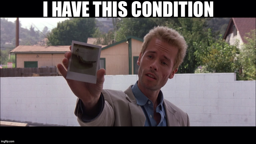 Guy Pearce in Memento holding a polaroid, captioned: I have this condition